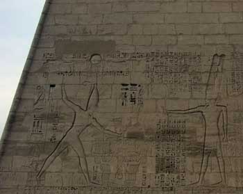Relief of Ramesses III smiting his foes on the pylon at Medinet Habu