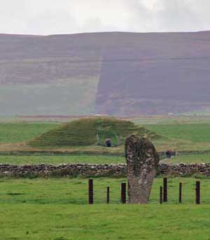 Maes Howe with the Barnhouse Stone in the foreground