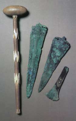 Bronze Daggers & Axe and a Stone Macehead with Bone Handle Mounts