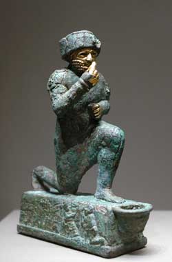 Unknown king of Larsa kneeling before a god