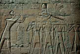 Ramesses II offering incense to Amun in his barque